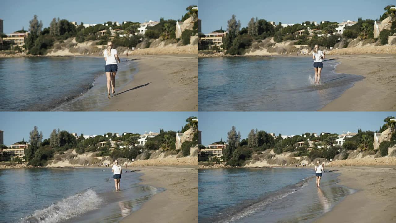 年轻女子听音乐，沿着海边的海滩奔跑