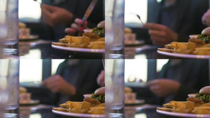 几个人在吃垃圾食品，在餐厅吃晚饭，特写镜头