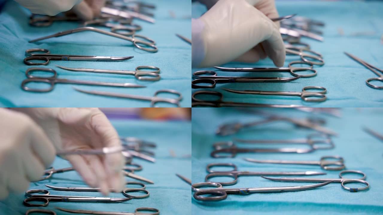 4k特写护士手手套。护士在真正手术前准备手术包托盘。手术室库存视频中的手术台上排列的手术剪。