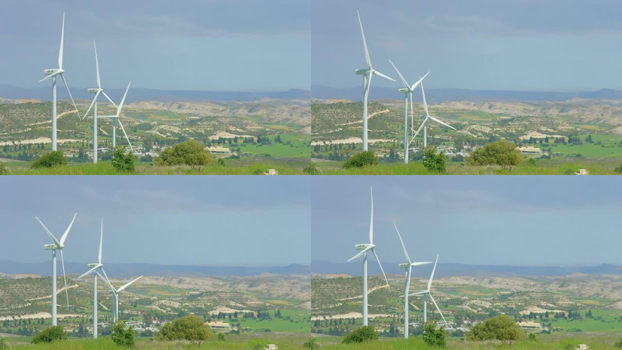 美丽的乡村景观，绿色的乡村，风力发电机旋转，高山