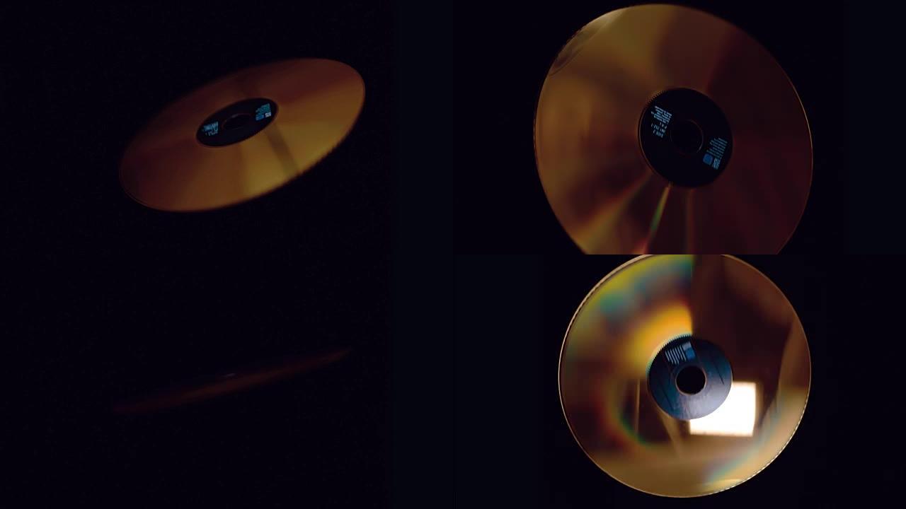 金色激光光盘在慢动作的黑色背景上闪烁，飞行和旋转