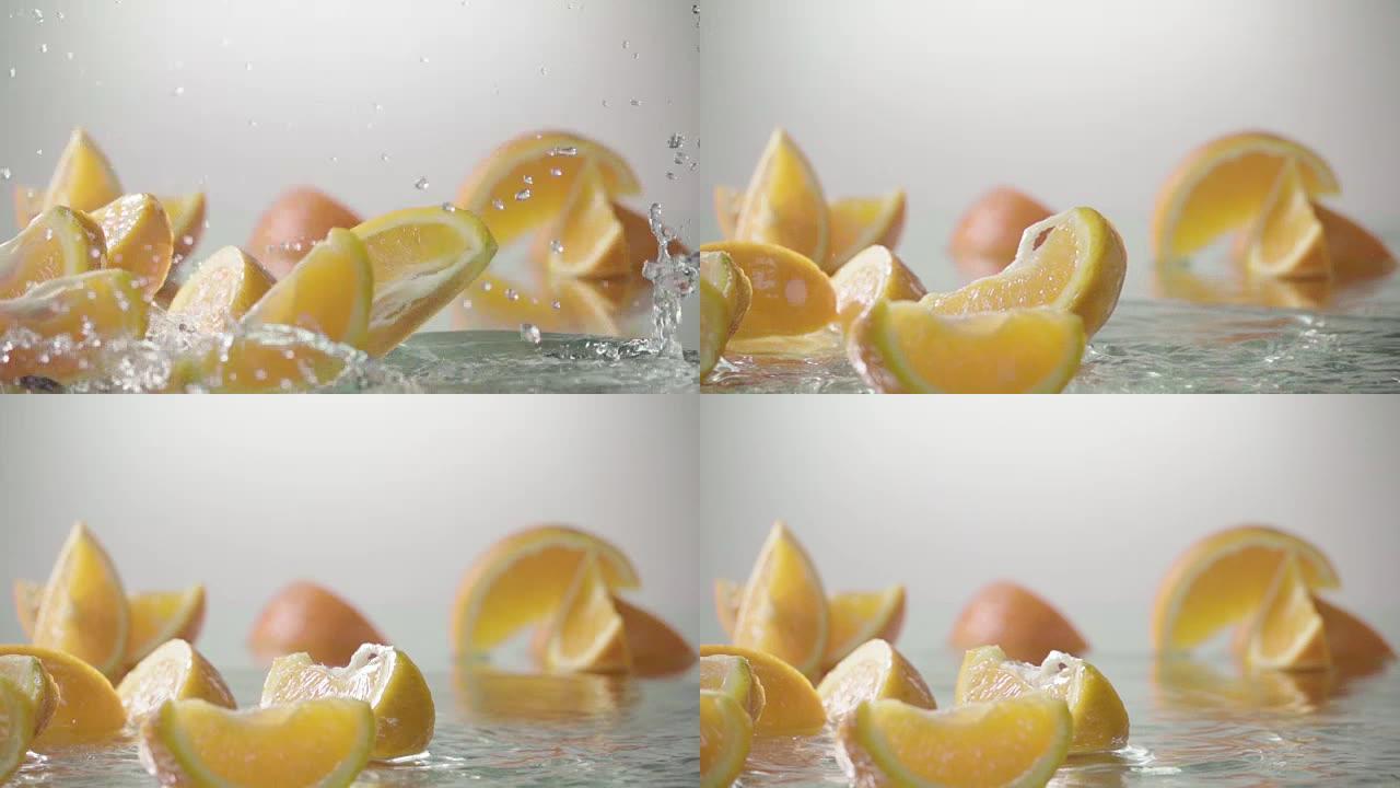 橙子击中橙汁表面并分成两半。慢动作镜头