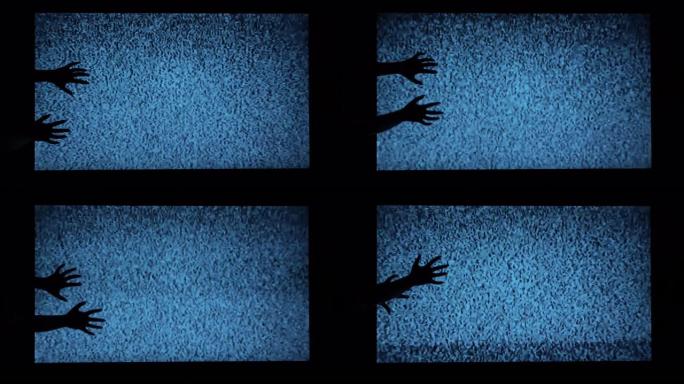 手放在恐怖电影的电视恐怖场景的背景上