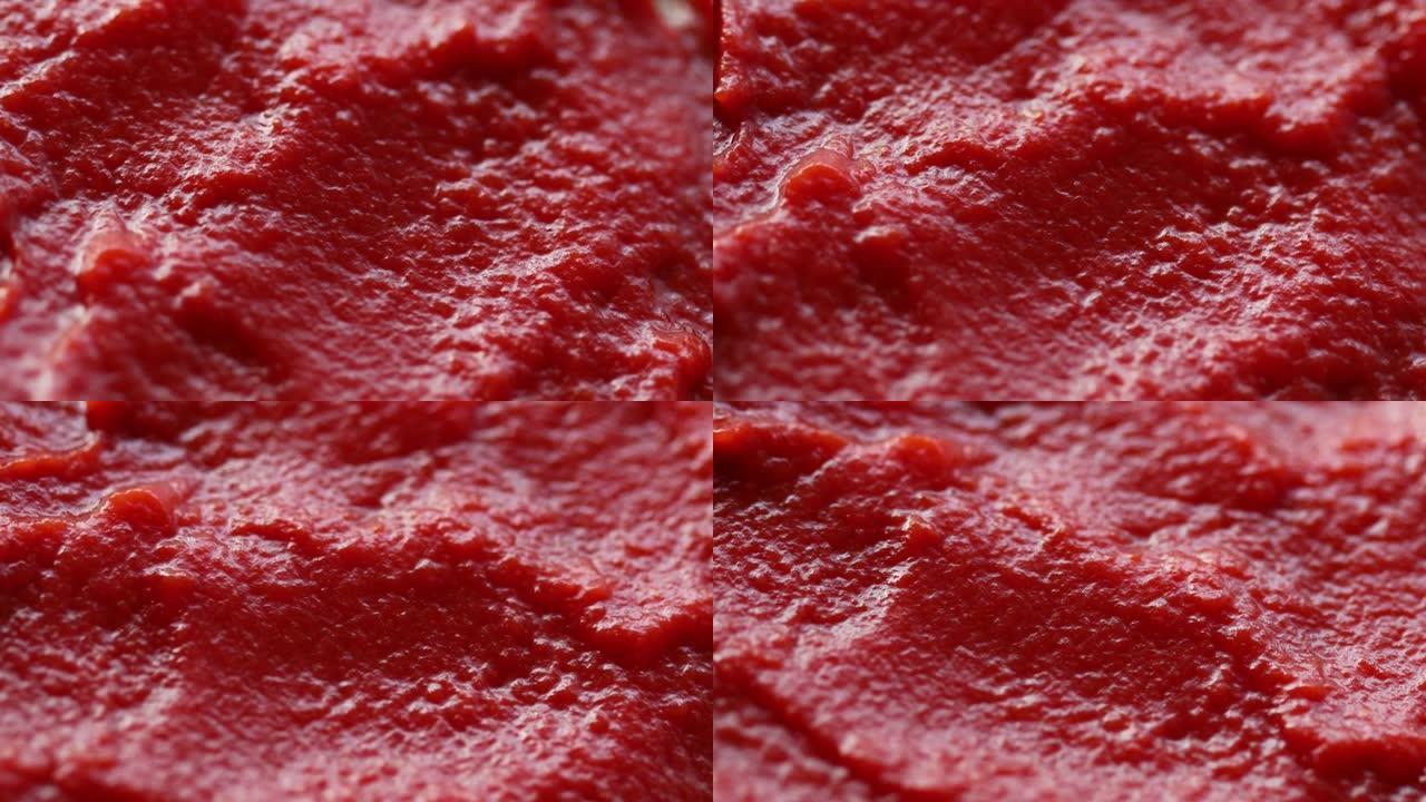 红番茄酱旋转成圆形。番茄酱特写