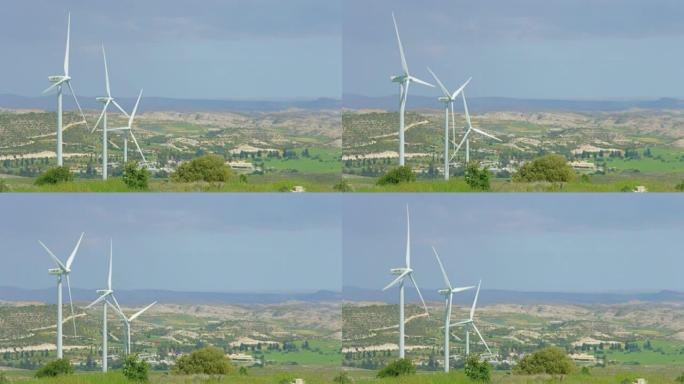 美丽的乡村景观，绿色的乡村，风力发电机旋转，高山