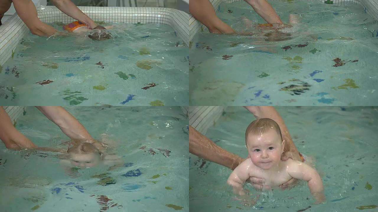 小婴儿在儿童游泳池的水下游泳