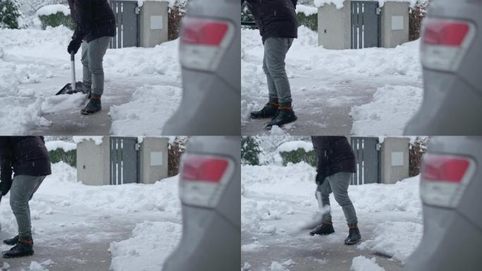 LD男子清除积雪的车道
