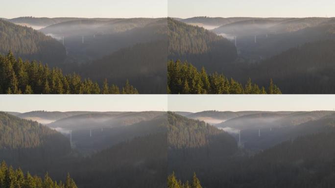 空中无人机在日落时拍摄的丘陵森林