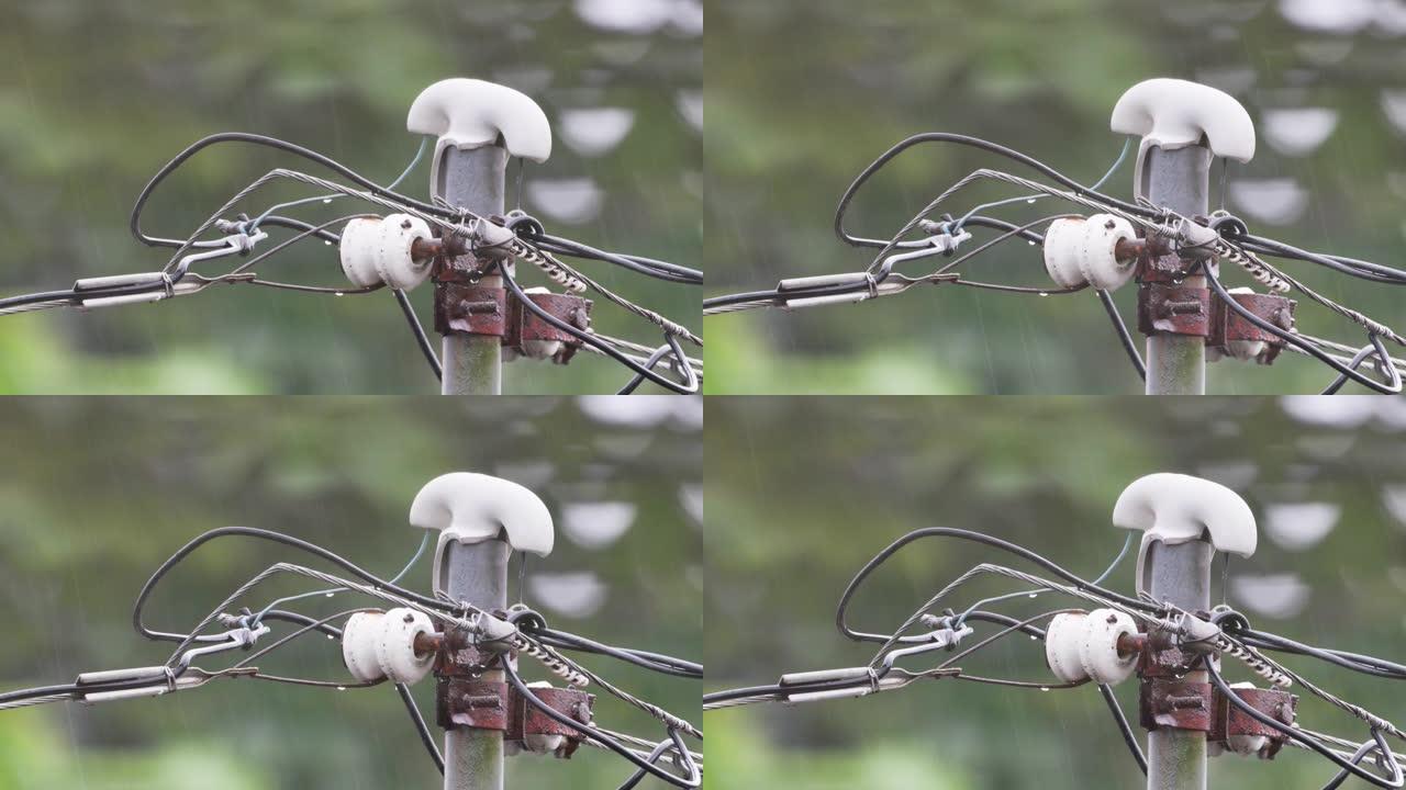 在细雨中磨损的电缆支撑杆，能源和节约的概念