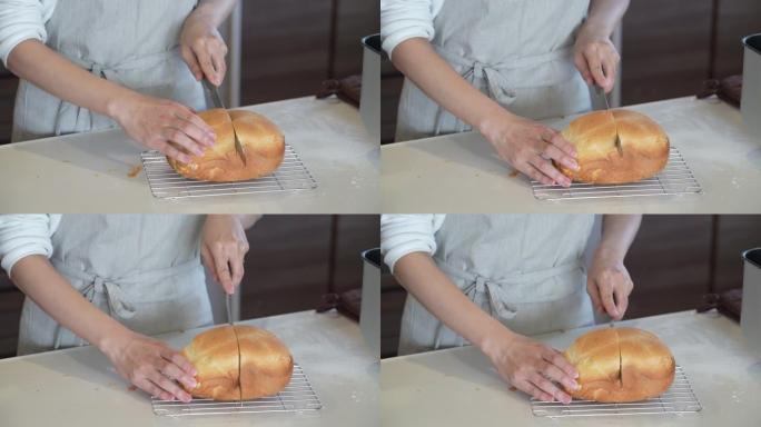 女人切自制面包