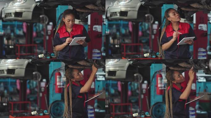 汽车服务、维修、保养理念。机械师在服务站检查汽车。车辆服务维护非洲妇女在车库检查汽车。