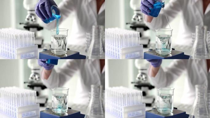 科学家将蓝色凝胶液体添加到实验室的漩涡水中