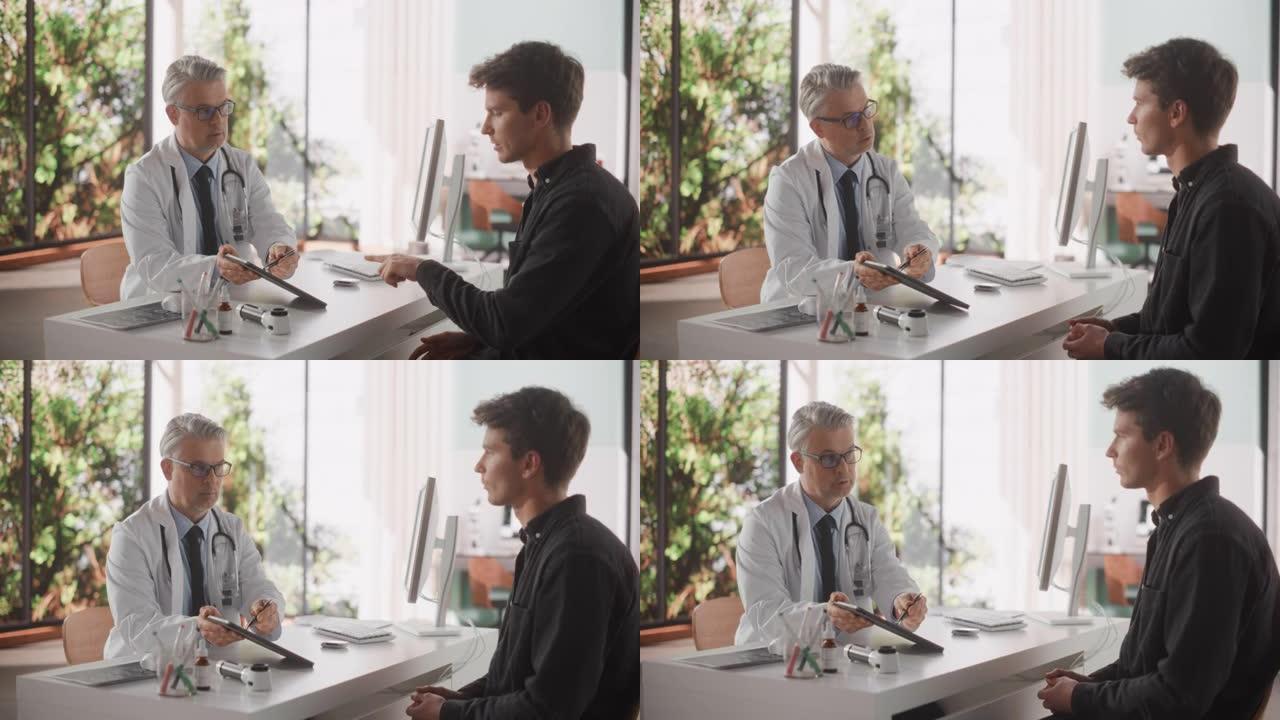 医生与优雅的灰色头发显示分析结果平板电脑上的一个健康的年轻人在访问私人健康诊所。在宽敞办公室的桌子后