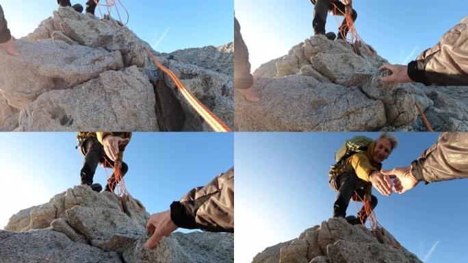 男性登山者为同伴提供帮助的中观
