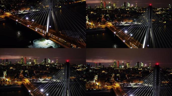 夜间华沙市摩天大楼和维斯瓦河大桥的无人机鸟瞰图