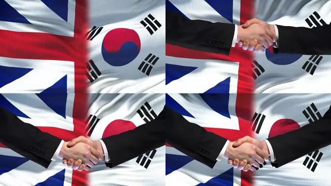英国和韩国握手国际友谊旗帜背景