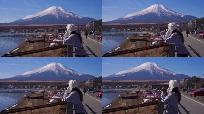妇女在山中湖和富士拍摄风景