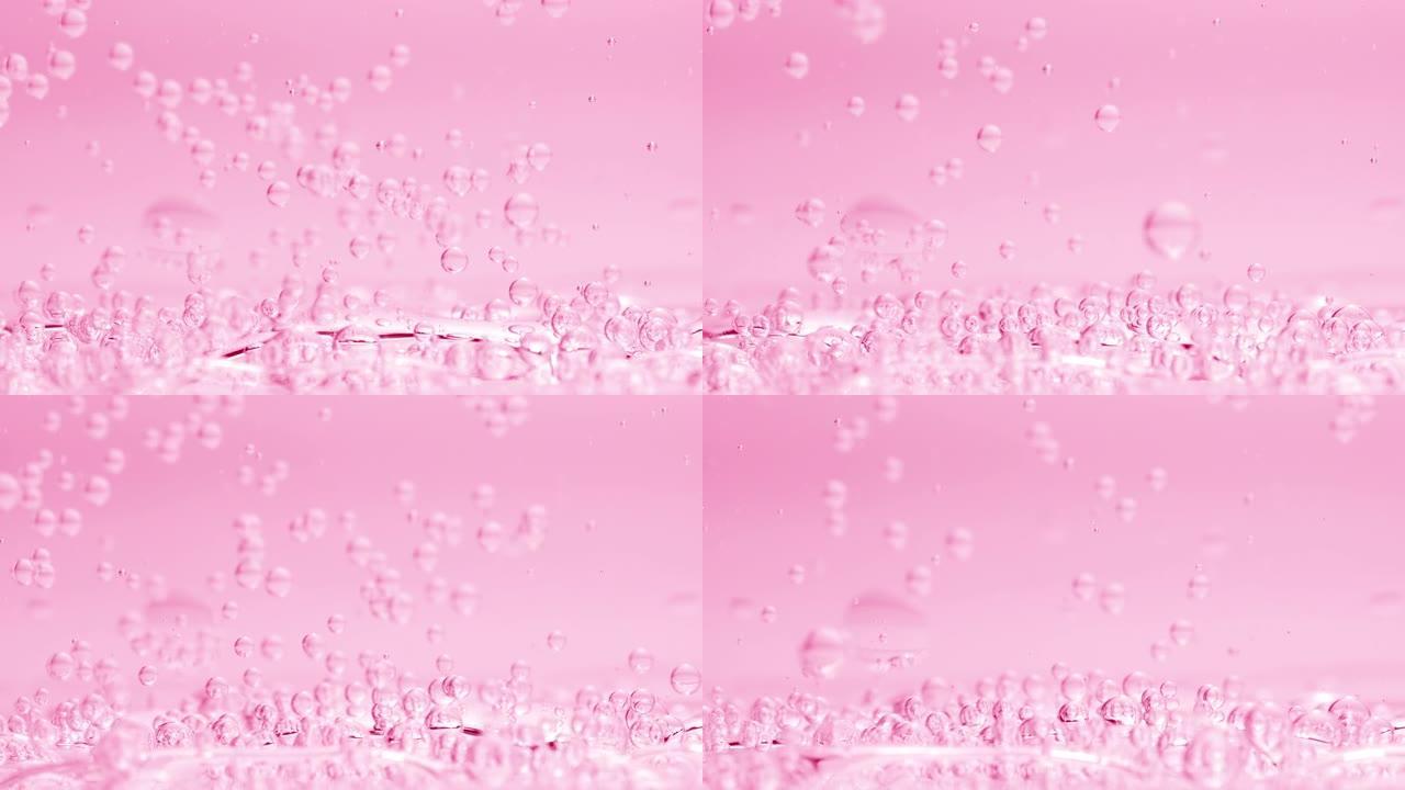 气泡沉入液体表面，另一个粉红色背景