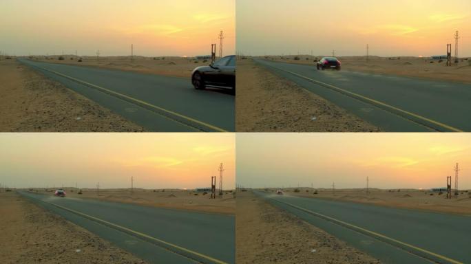 保时捷 (汽车) 在迪拜沙漠型环境中的黑色赛车。日落时吹来的灰尘