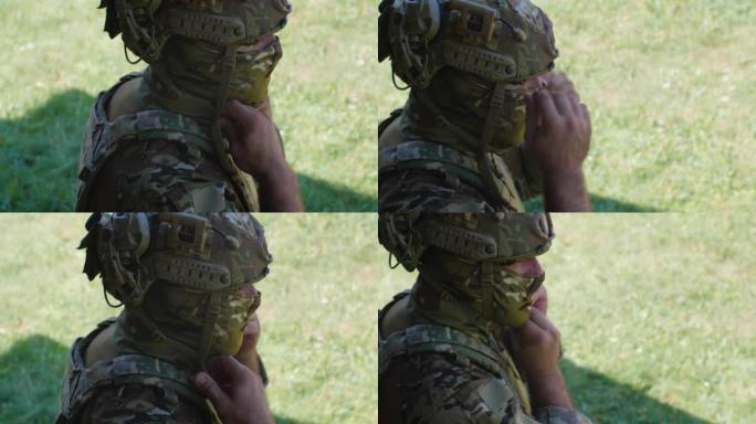 识别不出的男性士兵在准备军事演习或战斗时戴上防护头盔和伪装巴拉克拉瓦面具。乌俄战争