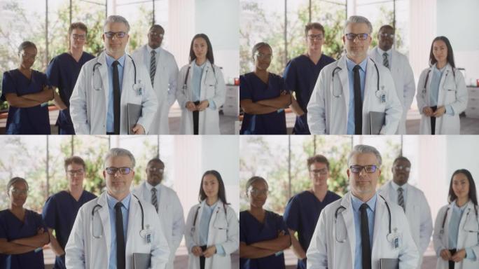 由男女医生，护士和医疗保健专业人员组成的成功的多种族团队为镜头和微笑摆姿势。一位自信的中年医生站在第