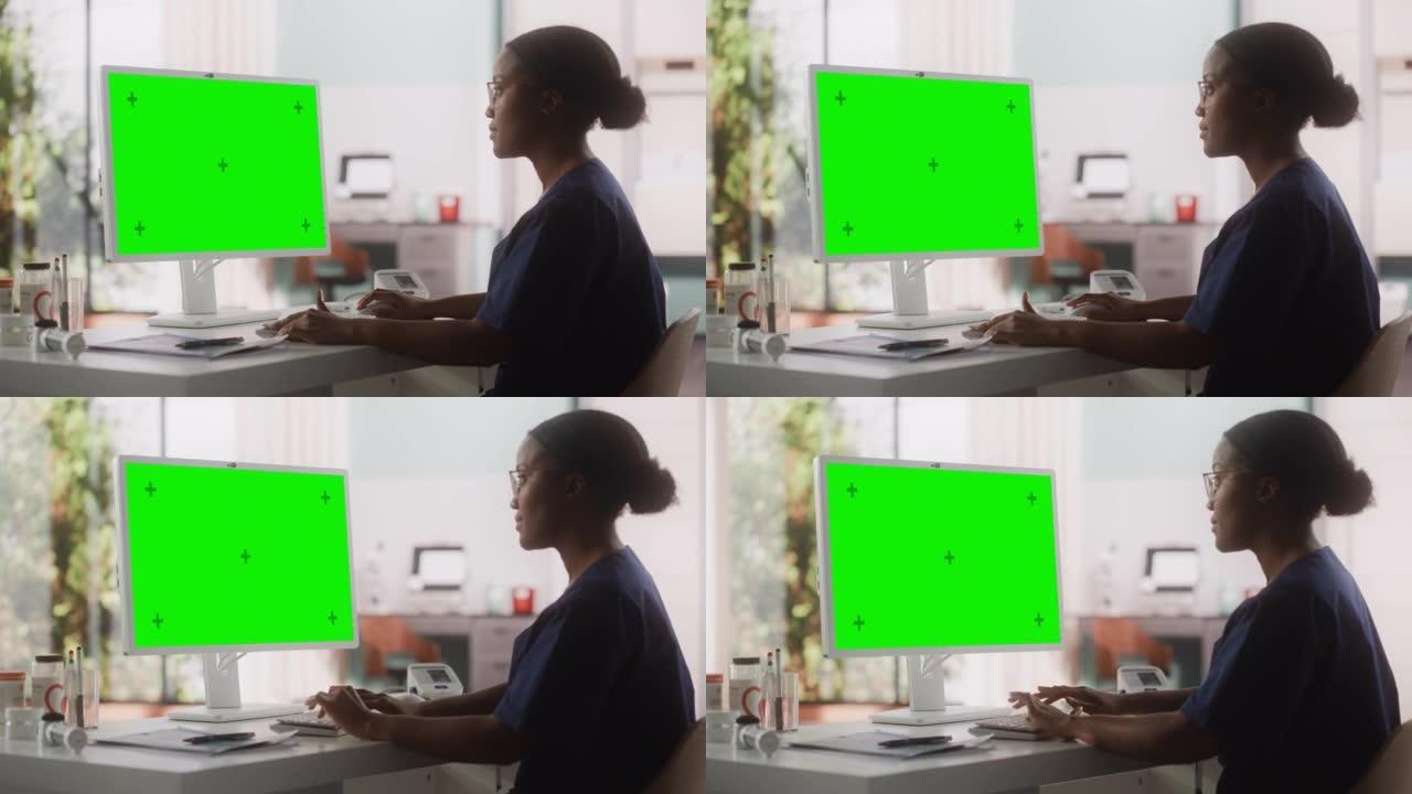 非洲医疗保健护士使用带有绿屏模拟显示的台式计算机进行日常医院运营。美丽的年轻诊所专业人员使用PC进行