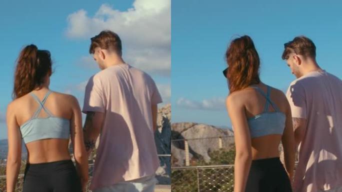旅游旅行中的异性恋夫妇。暑假浪漫约会一起散步观光垂直视频