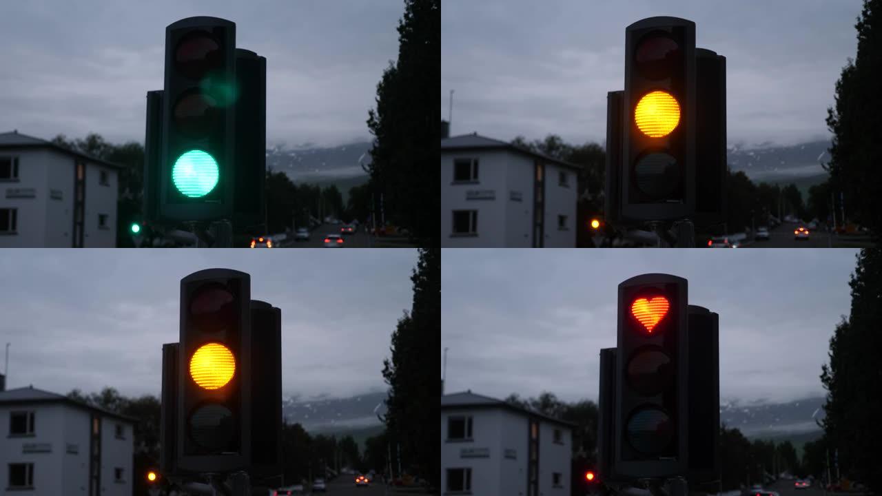 Akureyri的红色带有心形符号的室外垂直交通灯。