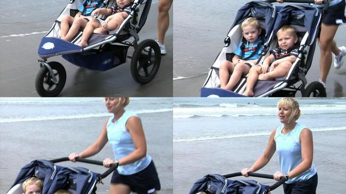 妈妈在海滩上推婴儿车