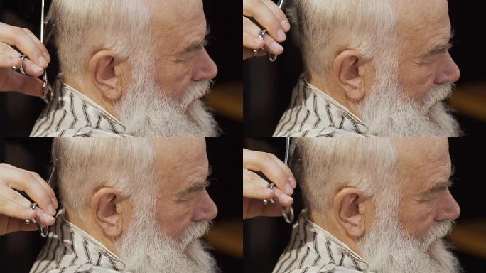 专业理发师剪老人的白发