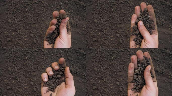 沃土整备田农业概念。一把泥土手捧泥土手田间农业农民手捧泥土有机土地。农业。肥沃的土壤。特写镜头。本空