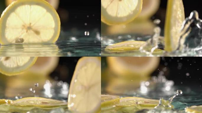 柠檬圈切片击中淡水表面。慢动作镜头