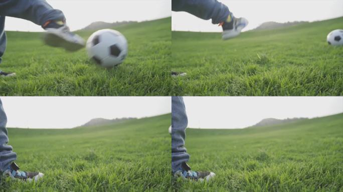 小孩踢足球瞬间草地足球训练欢乐童年时光