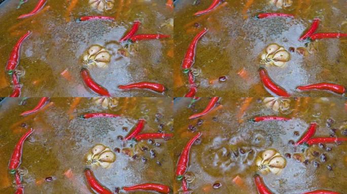 用铸铁锅在户外烹饪。用辣椒和大蒜炒羊肉。4k视频镜头UHD 3840x2160