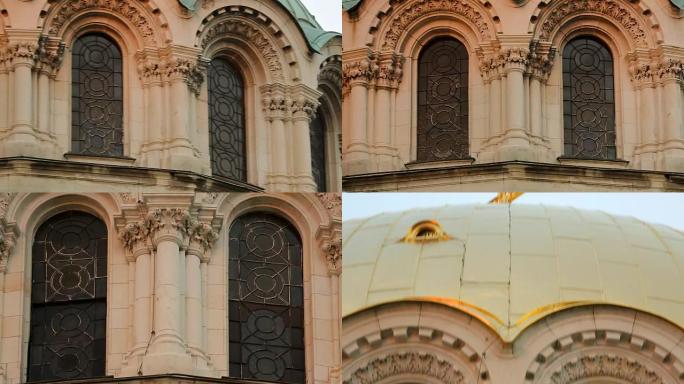 旧大教堂拱形彩色玻璃窗，带有金色十字架的圆顶
