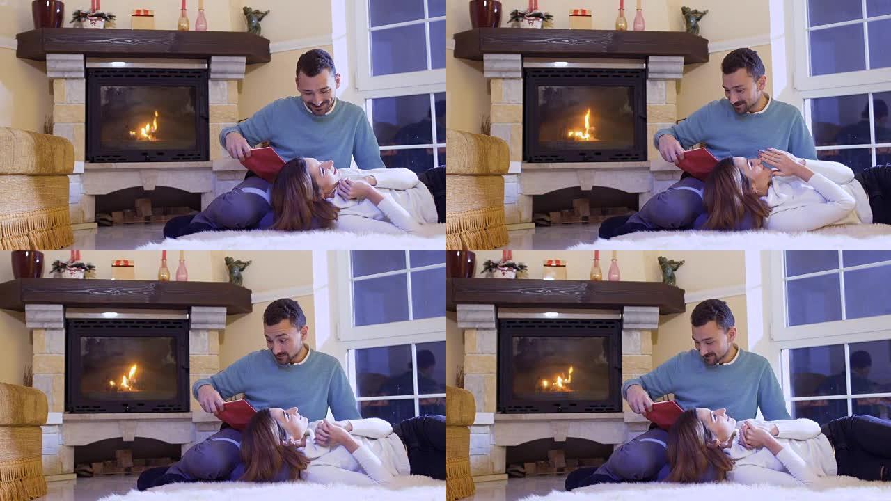 丈夫给妻子读了这本书，幸福的已婚夫妇在壁炉旁放松