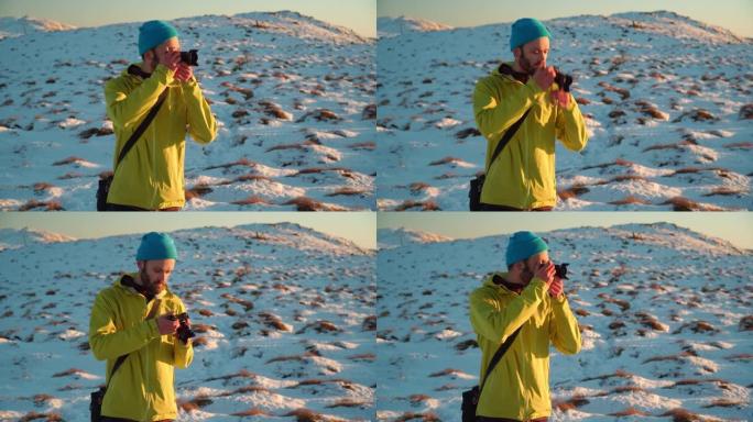 男性徒步旅行者在山顶拍照