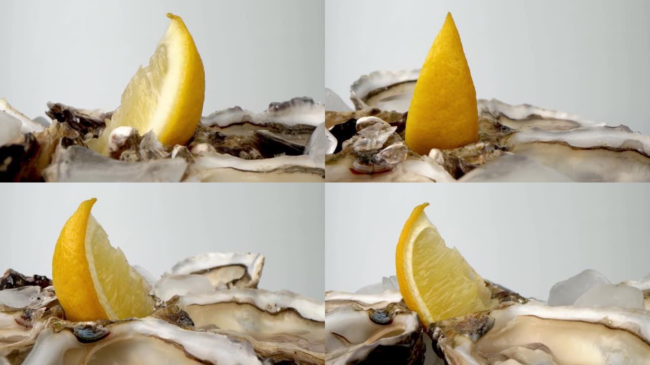 冰上牡蛎配柠檬特写。餐厅大盘子半壳新鲜牡蛎。上桌。4K UHD视频慢动作