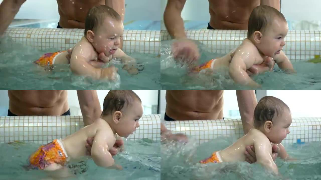 父亲在儿童游泳池里向小儿子泼水