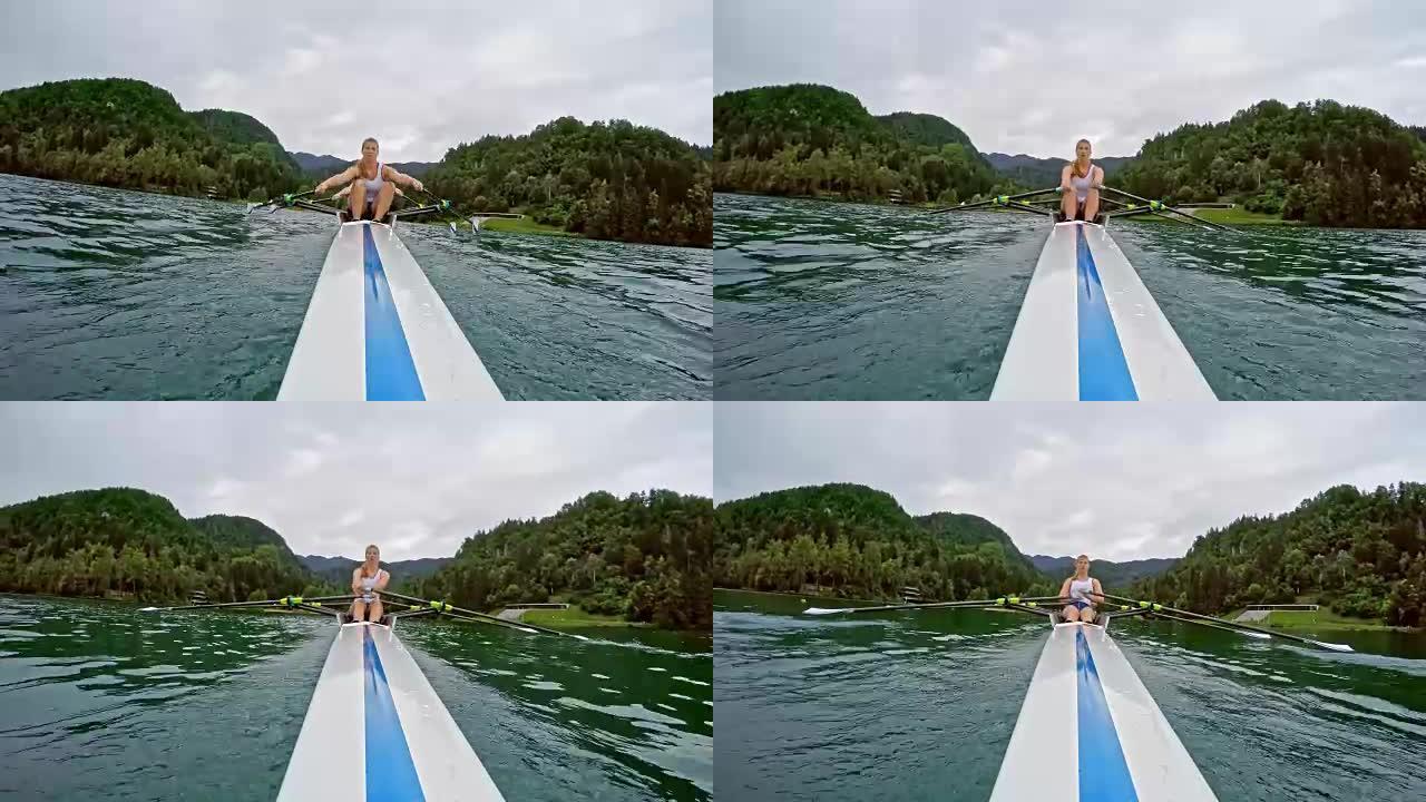 女双桨手划过一个湖