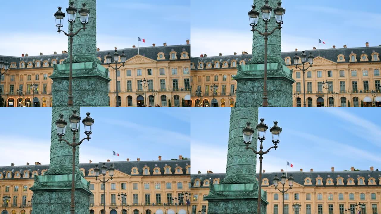 法国巴黎市中心的旺多姆广场景观。Vendome专栏背景为古老的经典建筑，多云的天空