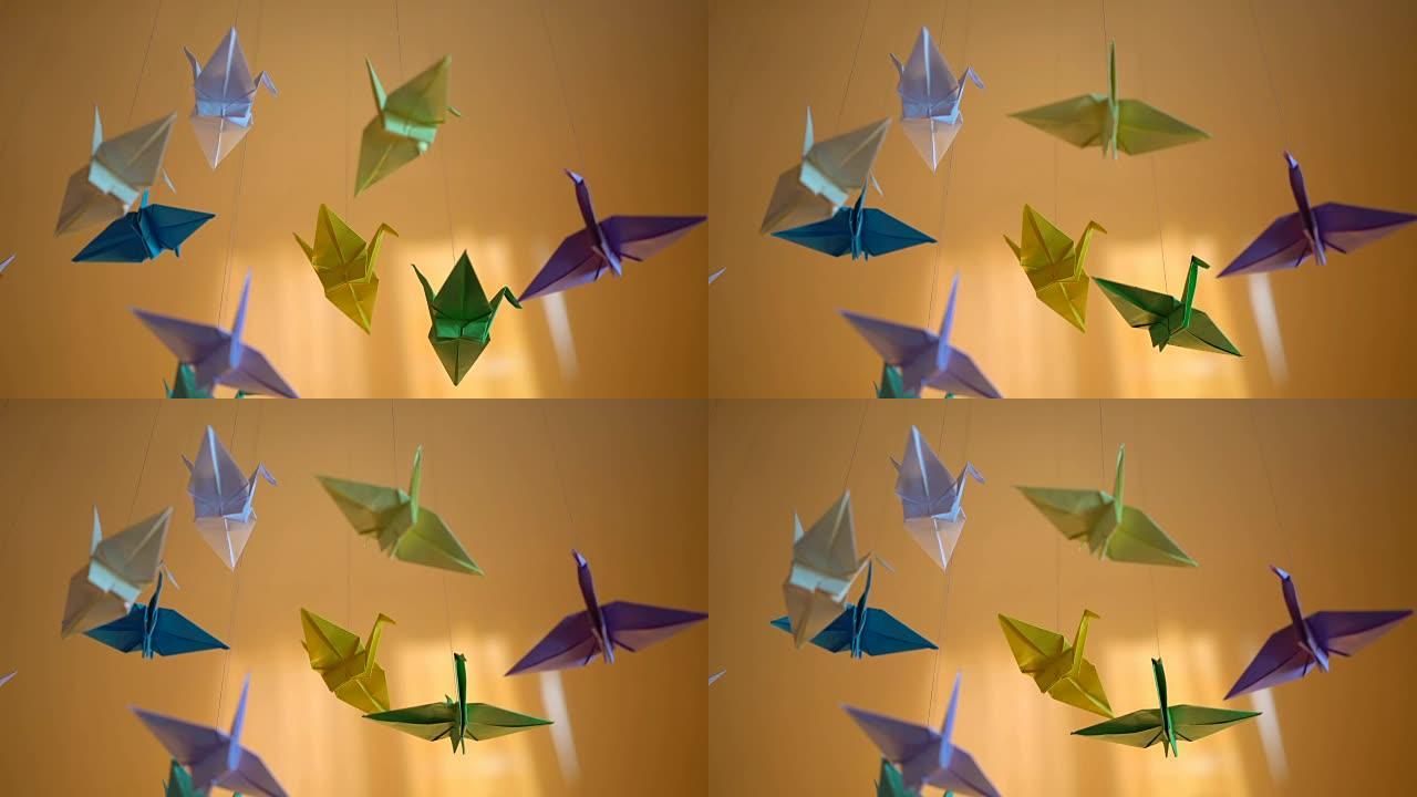 创意折纸纸鸟背景，线程上的手工玩具，想象力