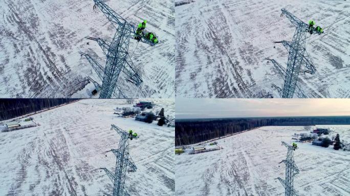 冬季景观中安装电塔的工人的空中倾斜镜头