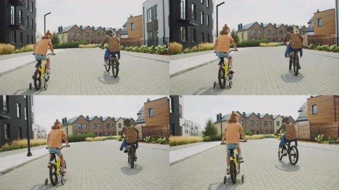 两个小孩在住宅区学习骑自行车