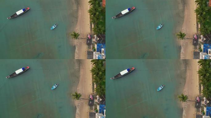 苏梅岛田园诗般的海滩附近的船的鸟瞰图