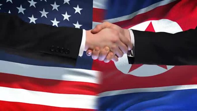 美国和朝鲜握手，国际友谊，国旗背景