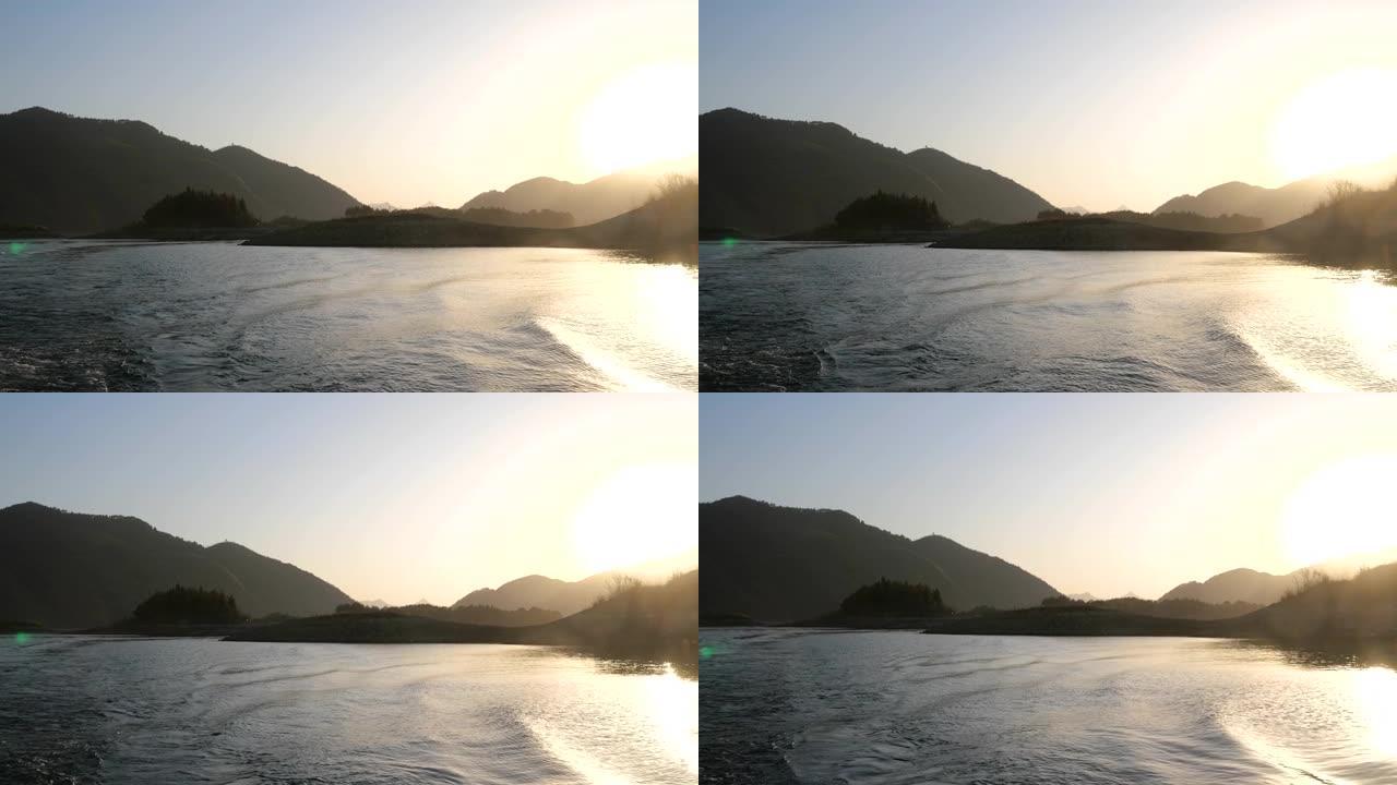 在湖中航行大海景色海平面日落