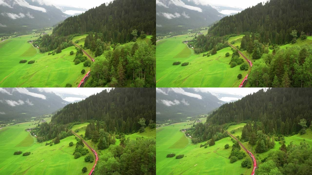 无人机4k。贝尔尼纳快速红色瑞士列车在瑞士阿尔卑斯山。