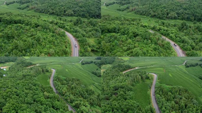 航拍行驶在东北山区道路的车辆