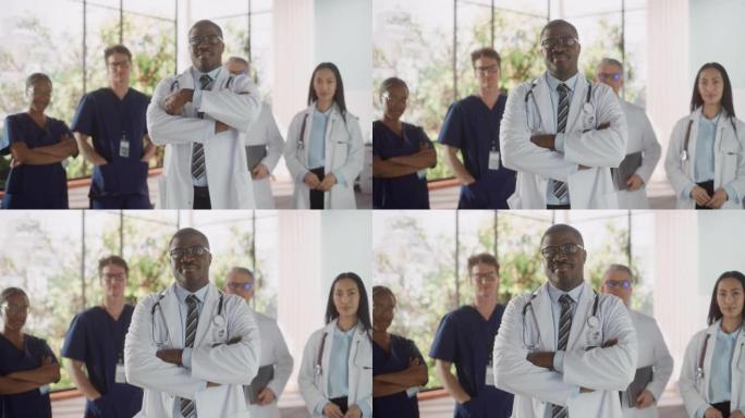 团队肖像的女性和男性成功的多元化医疗保健专业人员站在一个现代化的医院办公室。非裔美国医生站在靠近相机